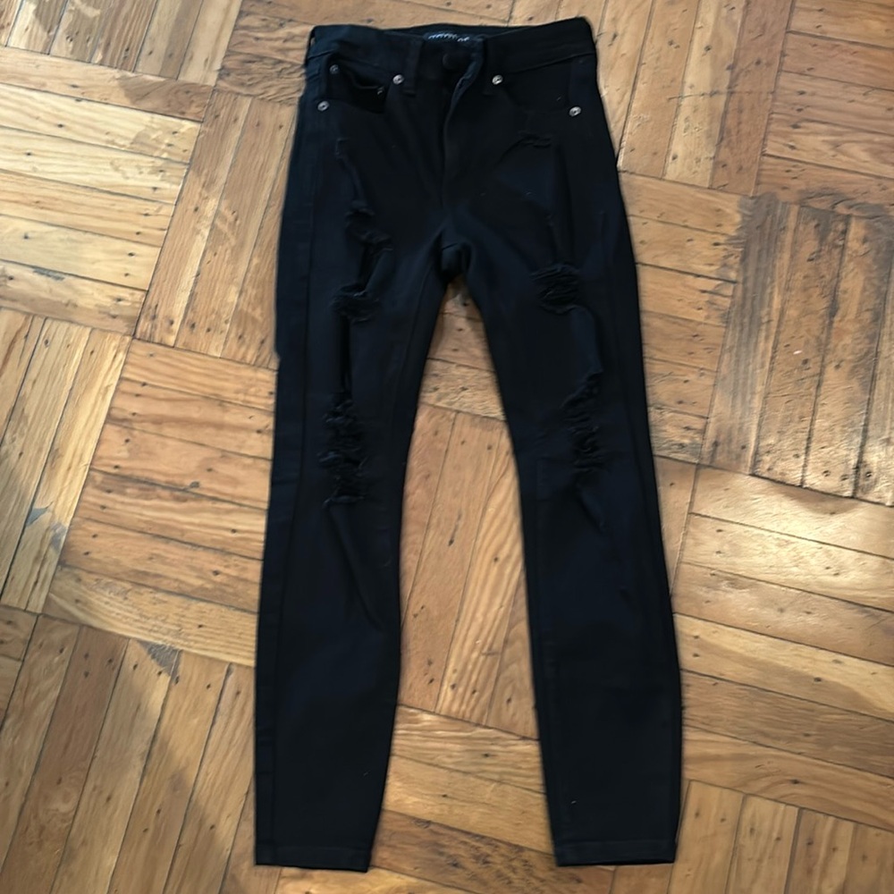Womens Aero High Rise, distressed black Jegging. Rips down front of pant legs
